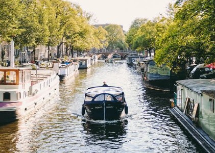  Boat travelling down water canal